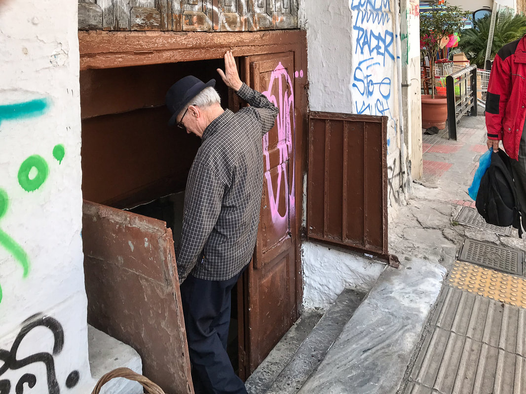 Rich entering Diporto Taverna, Athens, Greece / The Mystery of the Vanishing Greek Taverna / Karen McCann / EnjoyLivingAbroad.com