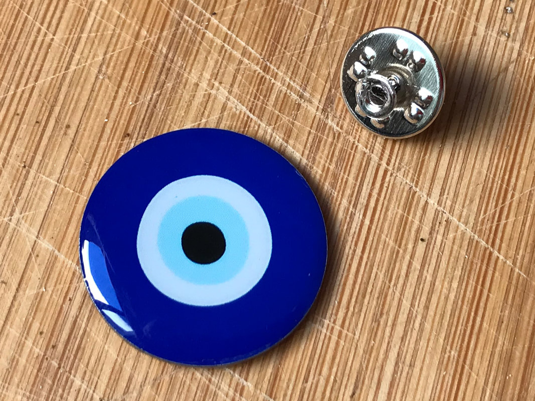 Nazar, talisman, warding off the evil eye, amulet, fetish / Seville, Spain / Athens, Greece  / Karen McCann / EnjoyLivingAbroad.com