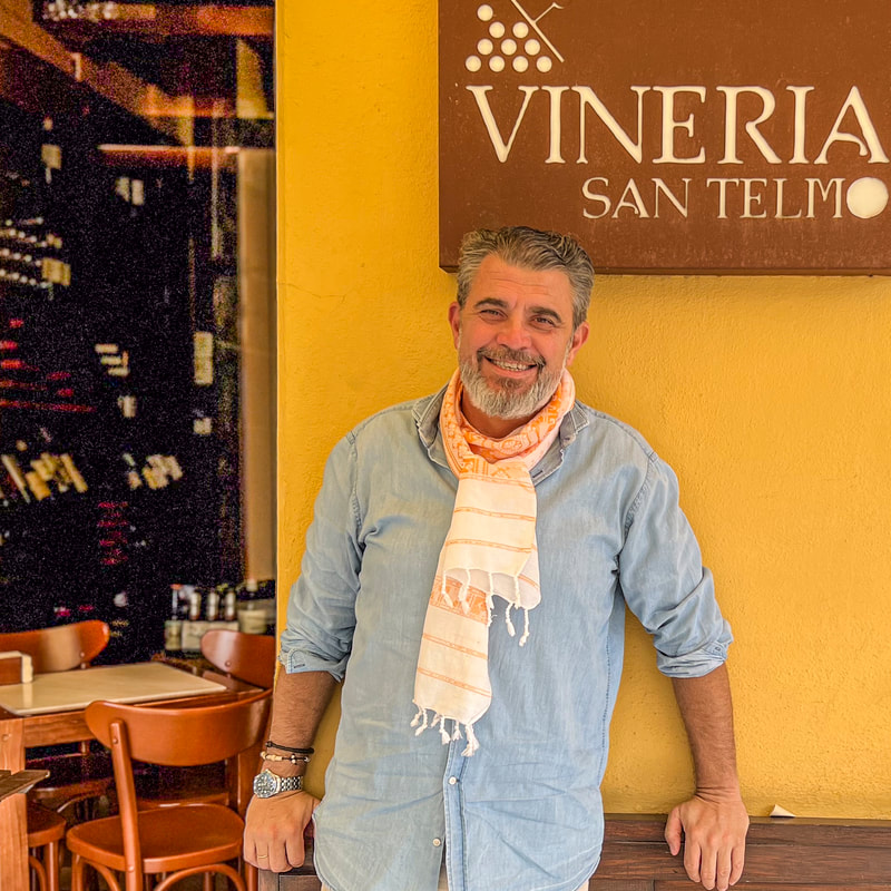 Juan at Vineria San Telmo / Health Benefits Dark Chocolate / The Amigos Project / Karen McCann / EnjoyLivingAbroad.com