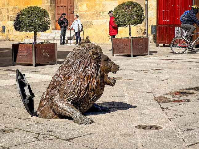 Lion crawling out of sewer / Léon, Spain / Nutters Tour of Spain / Karen McCann / EnjoyLivingAbroad.com