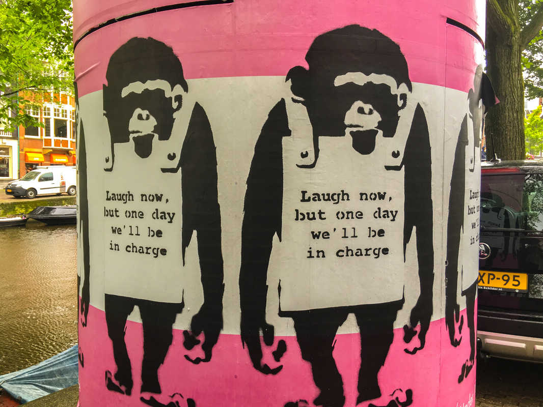 Rainy, Zany Amsterdam / Bansky poster / Karen McCann / EnjoyLivingAbroad.com