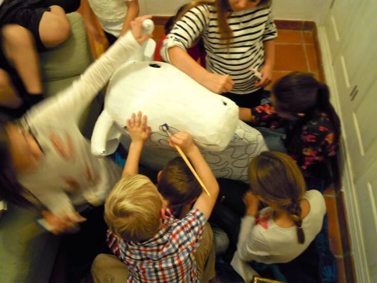 Kids painting bull's head / Why Are So Many Americans Considering Moving Abroad? / Karen McCann / EnjoyLivingAbroad.com